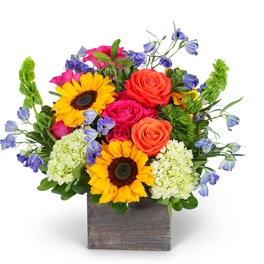 Bright mixed bouquet in a square wooden vase with sunflowers and roses