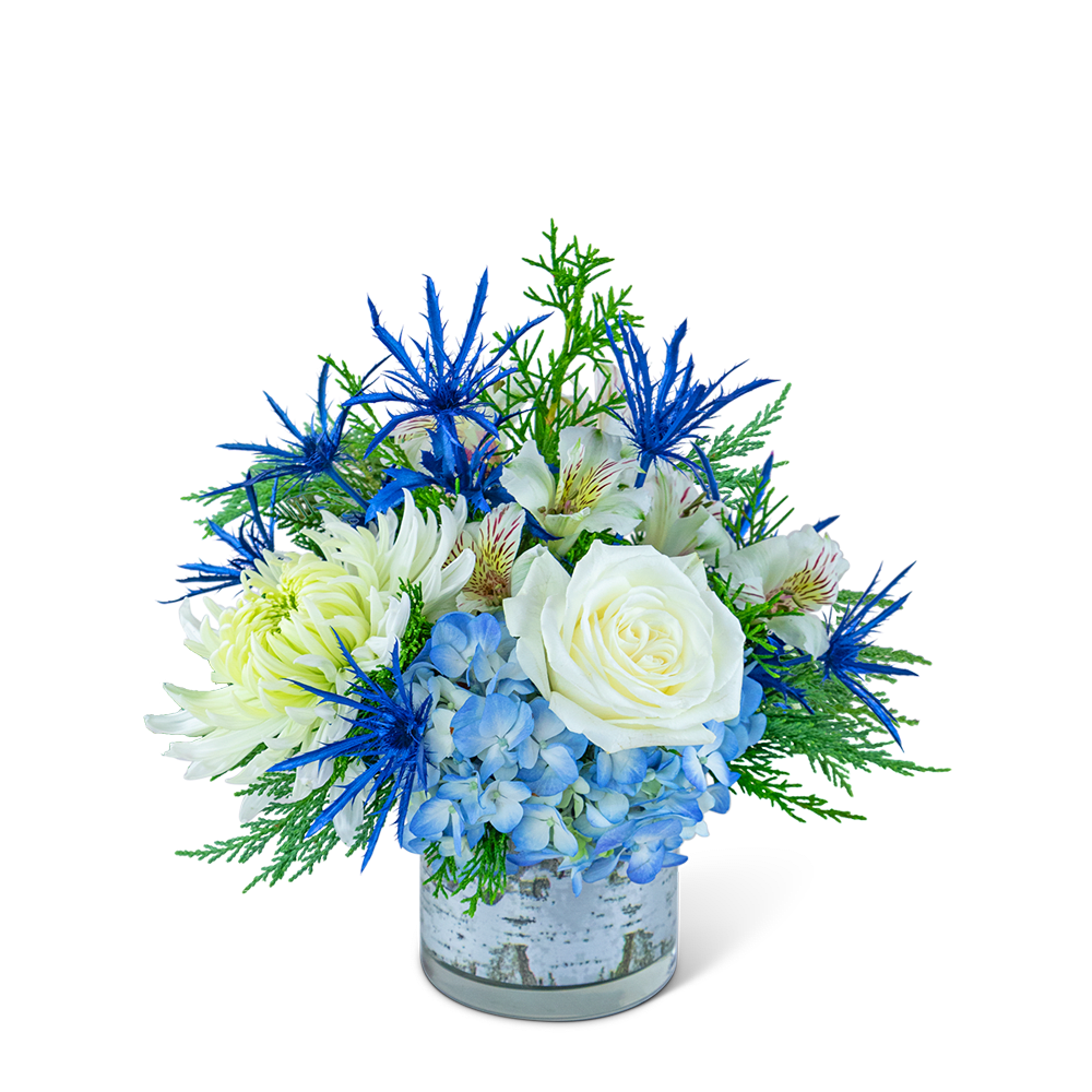 Blue and white floral arrangement in a glass vase