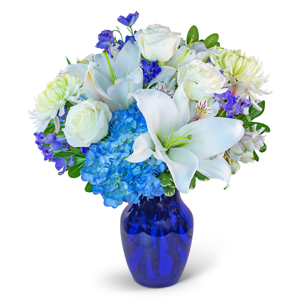 White lilies, roses, hydrangea, and purple flowers in a blue vase