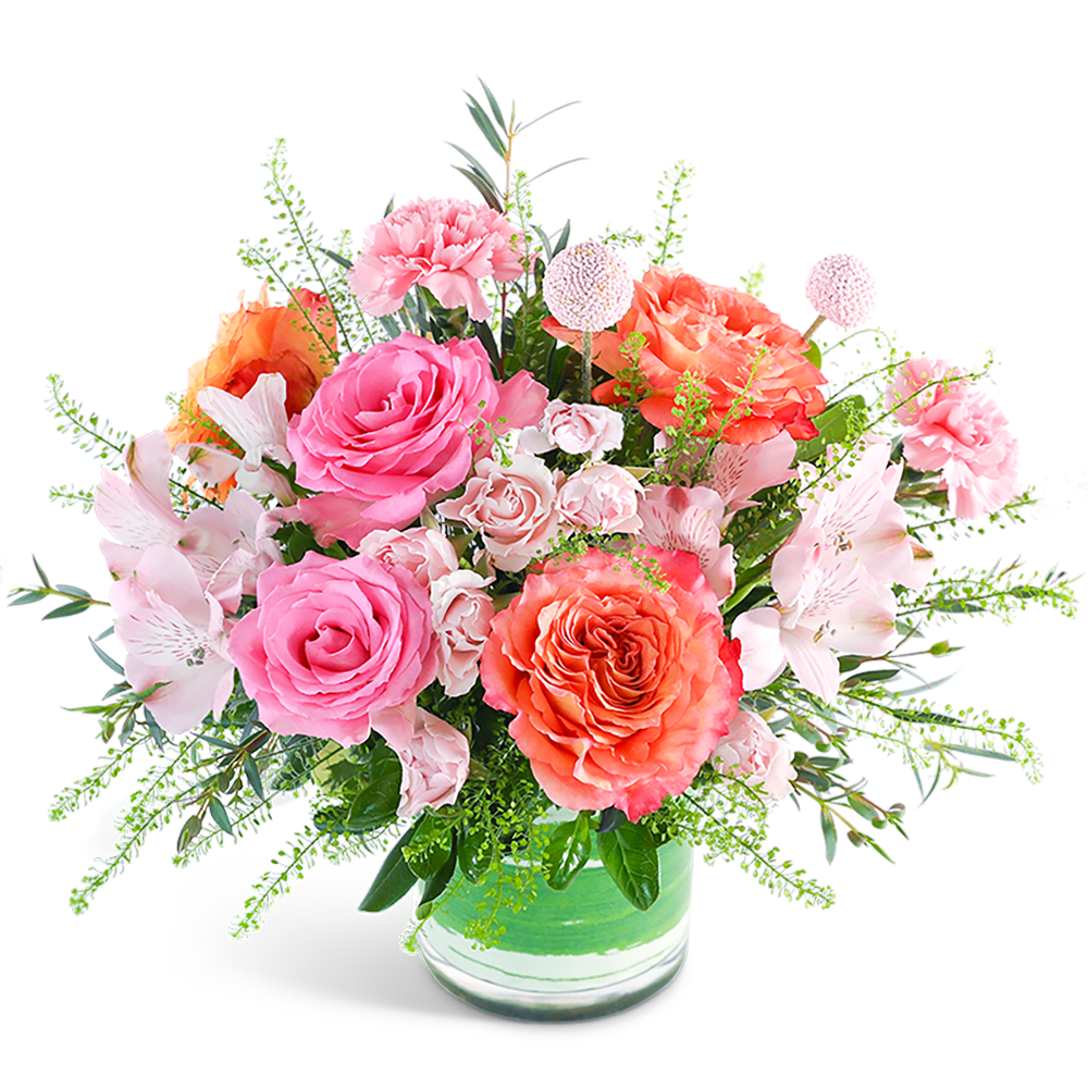 Pink and coral mixed bouquet in a glass vase