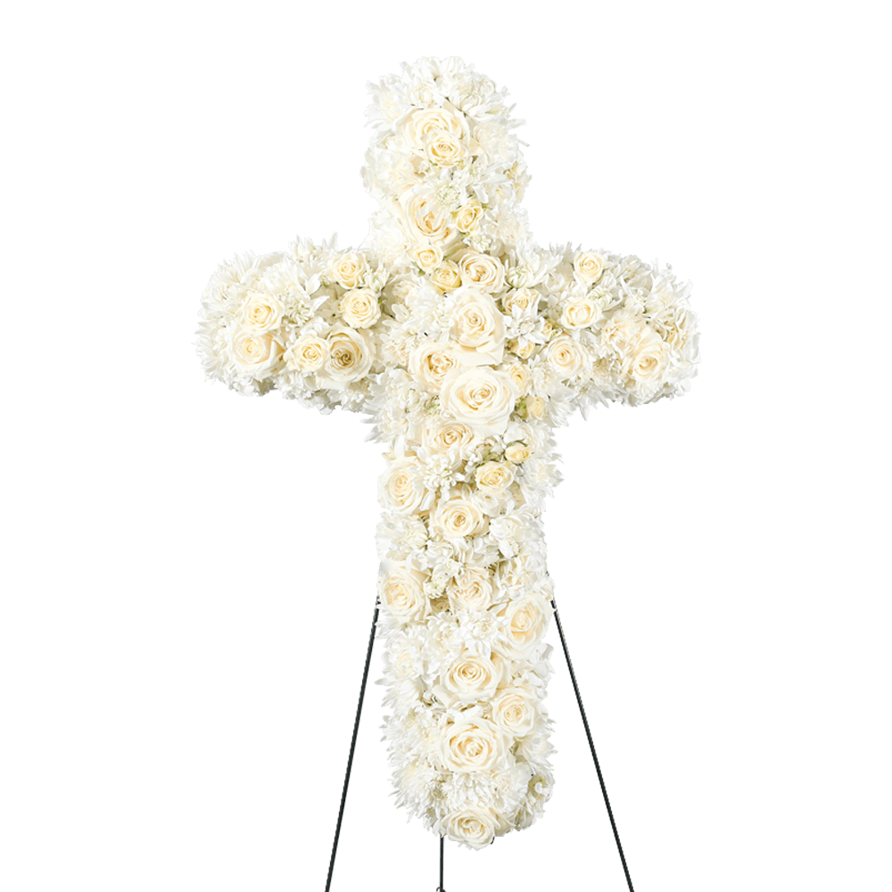 White floral cross on a stand with roses and chrysanthemums