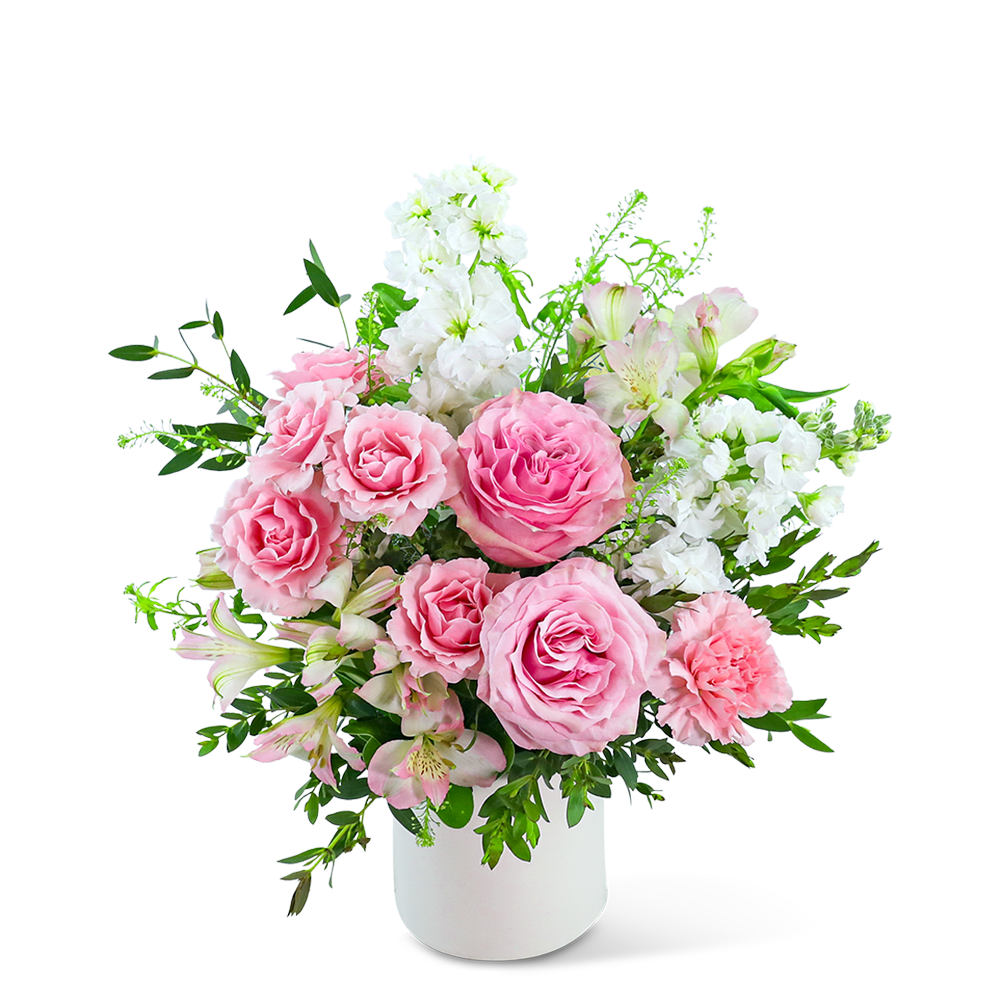 Pink roses and white flowers arranged in a white vase
