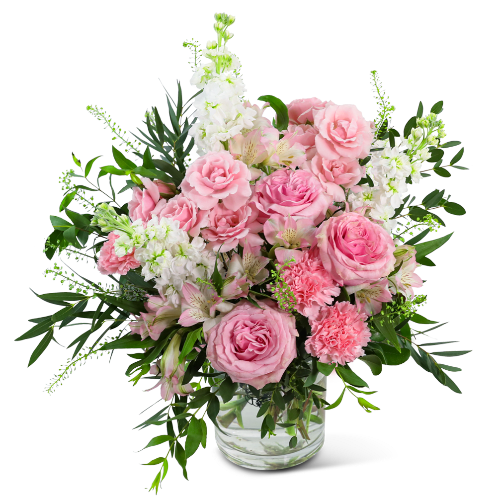 Pink roses and carnations in a clear glass vase