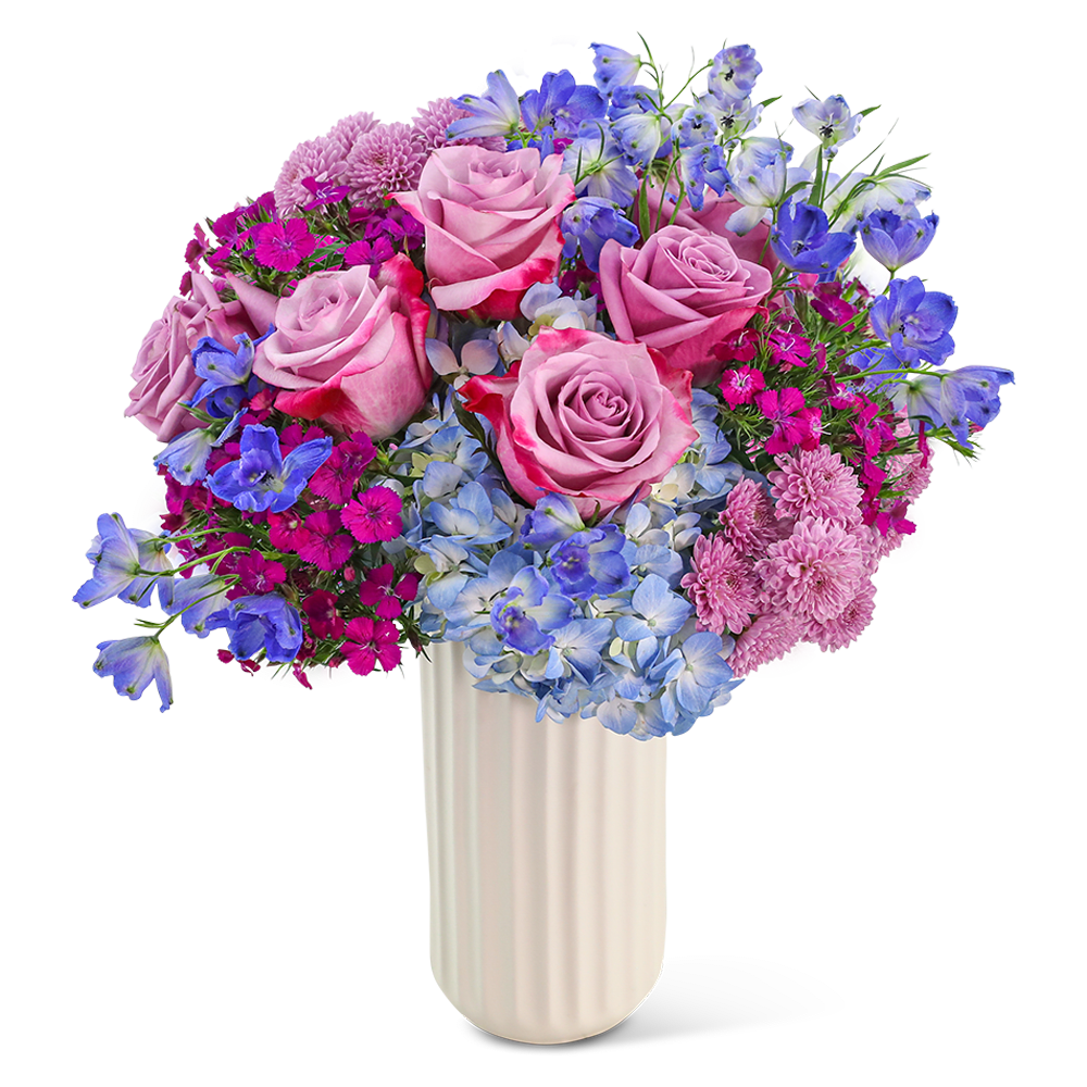 Bouquet of pink roses, blue hydrangeas, and purple flowers in a white vase