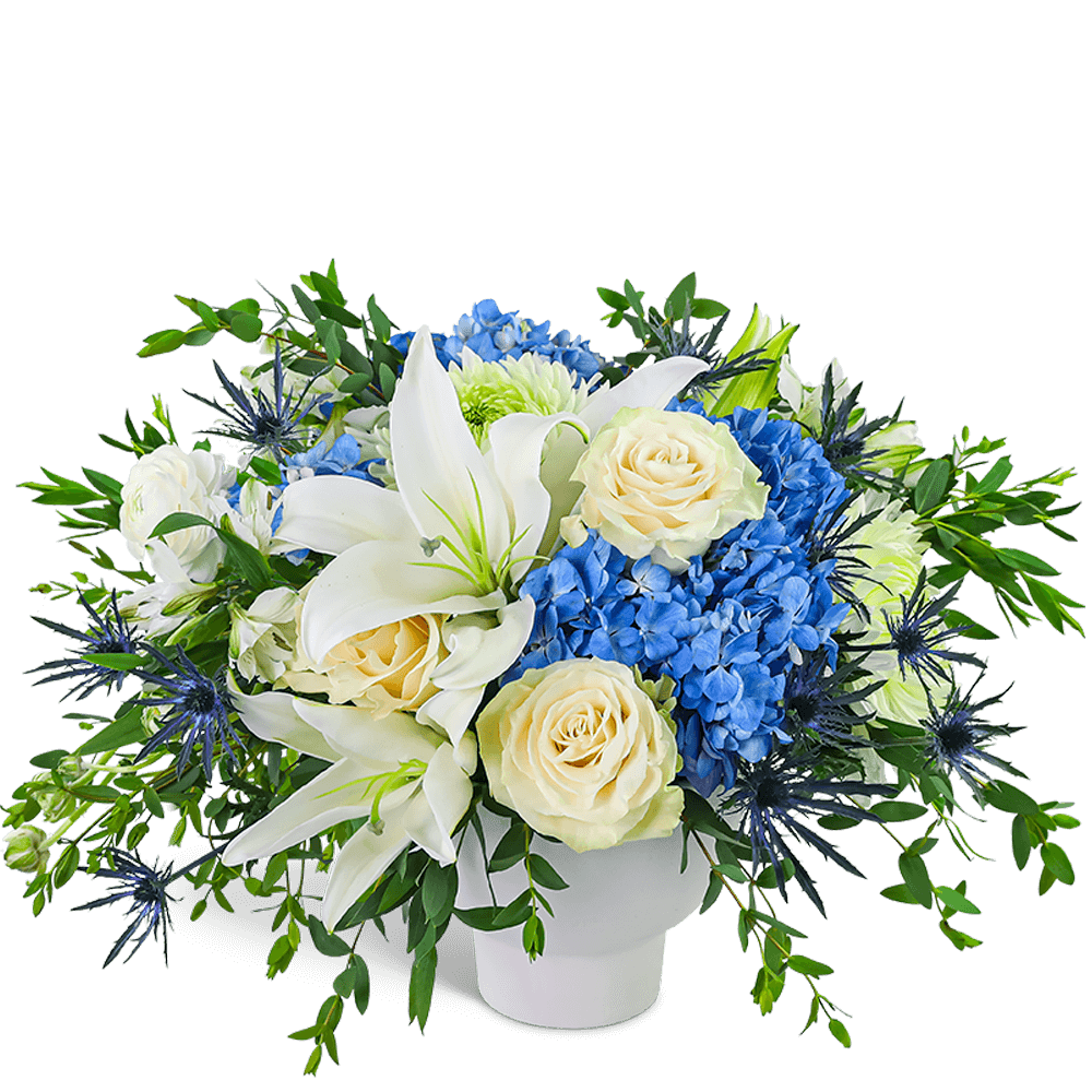 Skybound Blooms - Skybound Blooms is a serene and elegant mix of Lilies, Roses, Hydrangea, and accent flowers arranged in a modern white vase. Its timeless design makes it perfect for celebrating life's special moments or simply brightening someone's day. We proudly offer local flower delivery for any occasion.