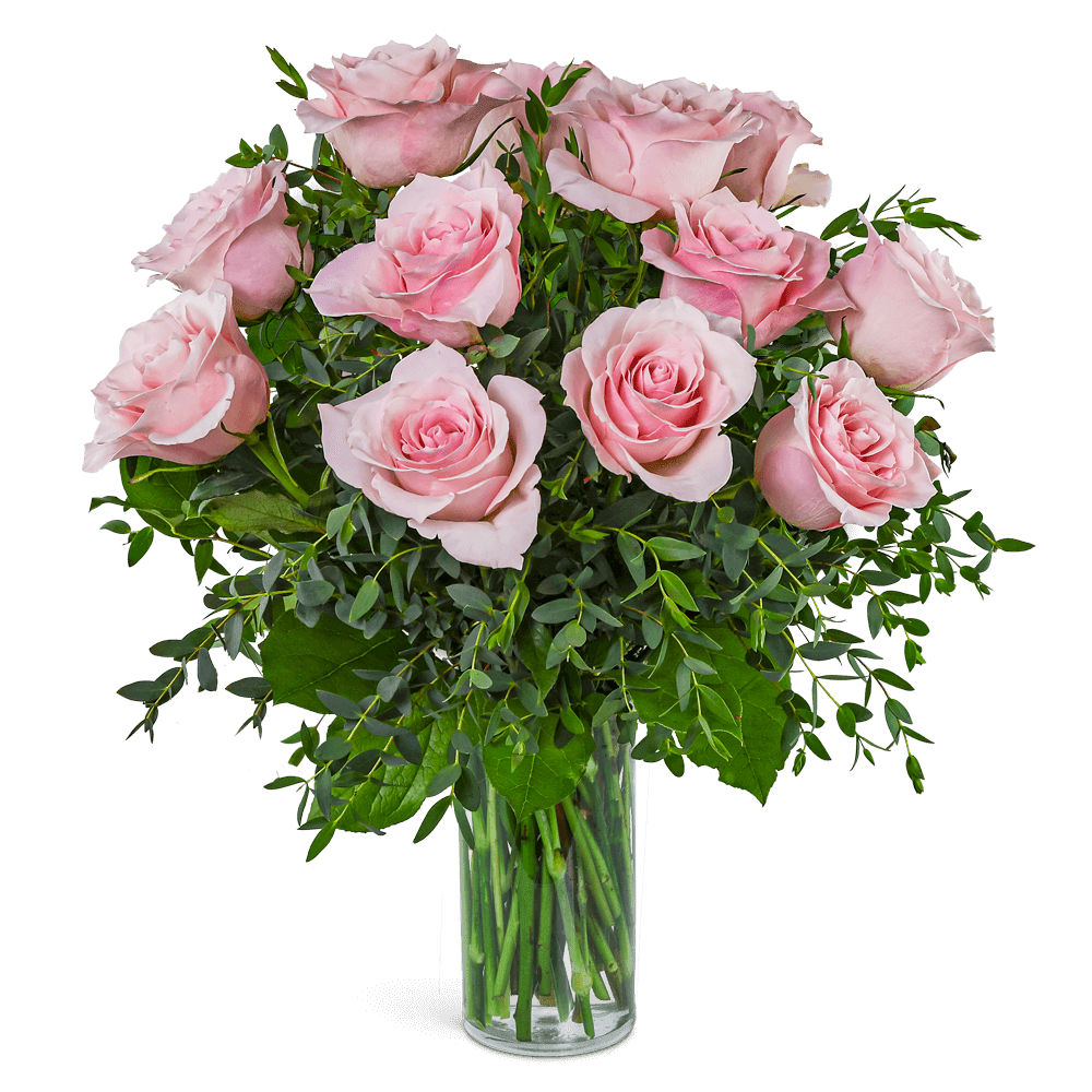 Pink roses arranged in a clear glass vase