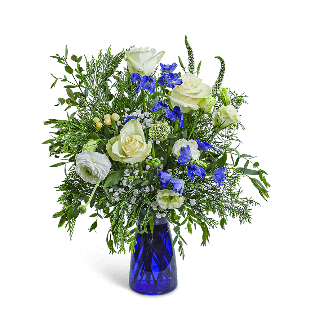 White roses and blue flowers in a blue glass vase
