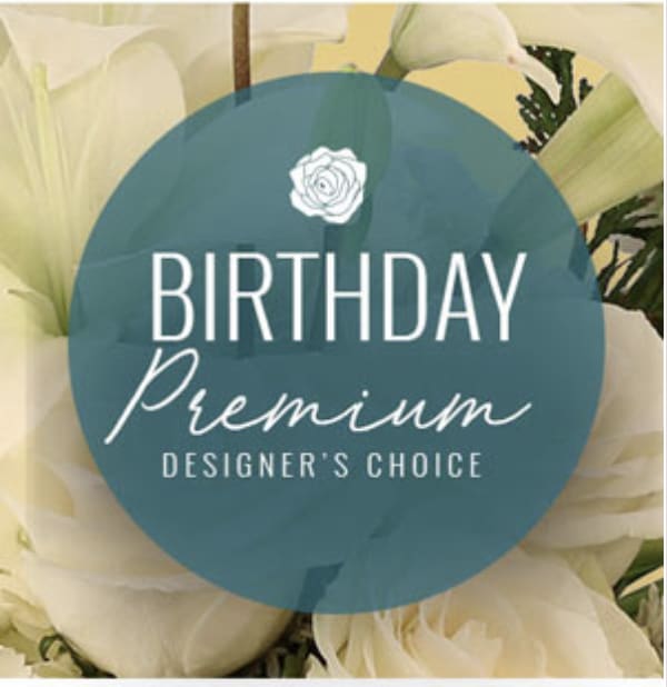 White flowers with a birthday premium label over the center