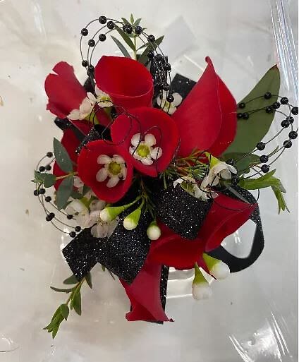 Red calla lily bouquet with black berry accents and ribbon