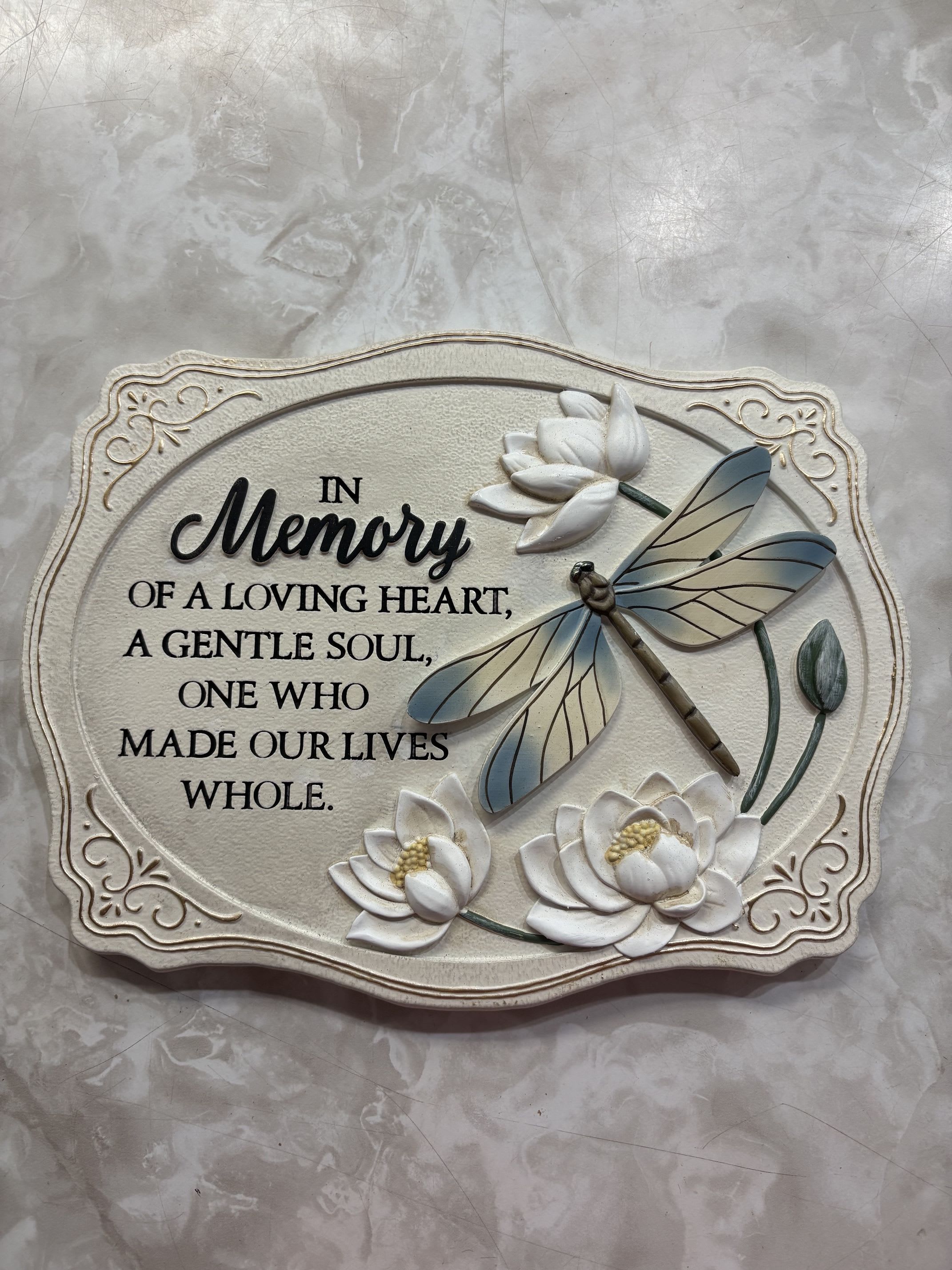 "In Memory" Dragonfly Garden Stone - This stone shows a Dragonfly and florals with a commemorating phrase: "In Memory of a Loving Heart, a Gentle Soul, One Who made our Lives Whole."  10.5" x 8"