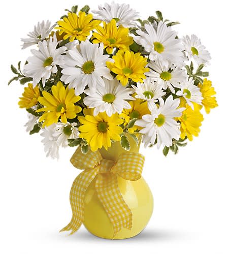 Yellow and white daisy bouquet in a yellow vase with a gingham ribbon