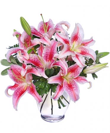 Pink stargazer lilies in a clear glass vase