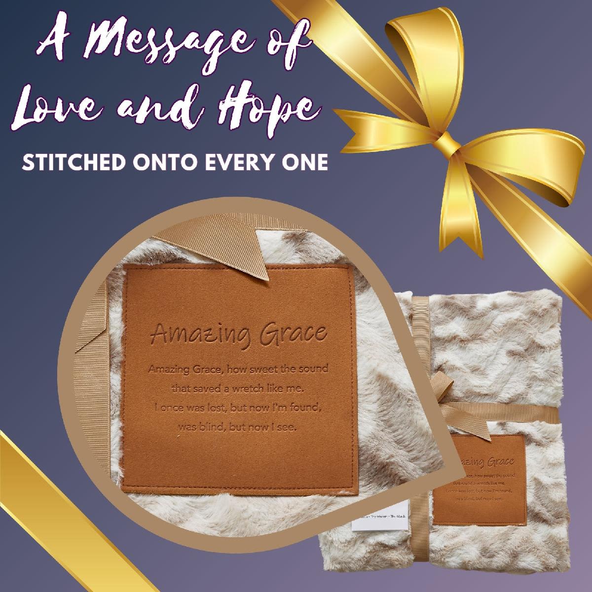 Fur-textured blanket with an embroidered "Amazing Grace" patch and gold ribbon