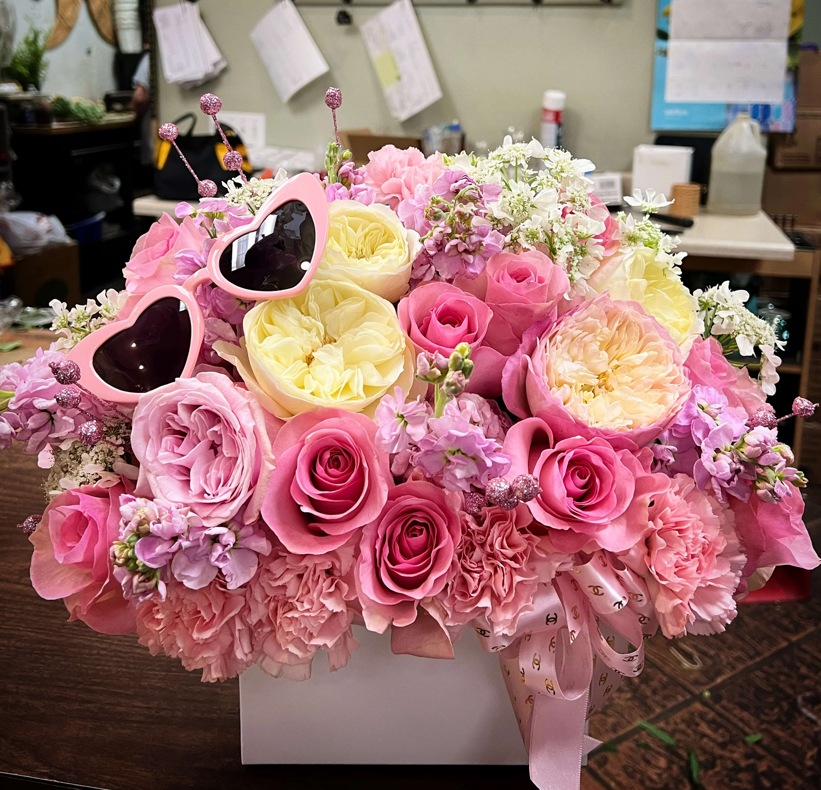 Pink and yellow rose bouquet with heart-shaped sunglasses