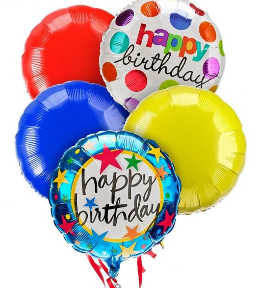 Cluster of colorful birthday balloons with printed messages