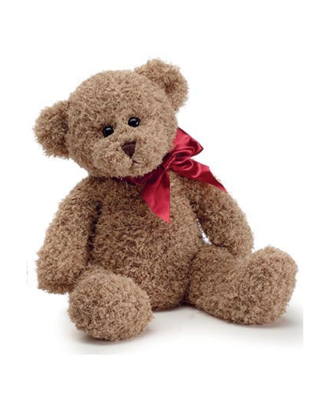 Brown teddy bear with a red ribbon bow