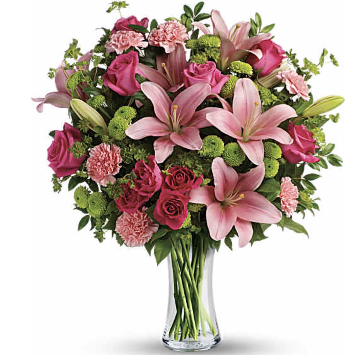 Dress To Impress - (ONE-SIDED) A vibrant bouquet of pink lilies, roses, and carnations arranged in a clear glass vase, accented with green filler flowers and foliage, creating a fresh and elegant display. 