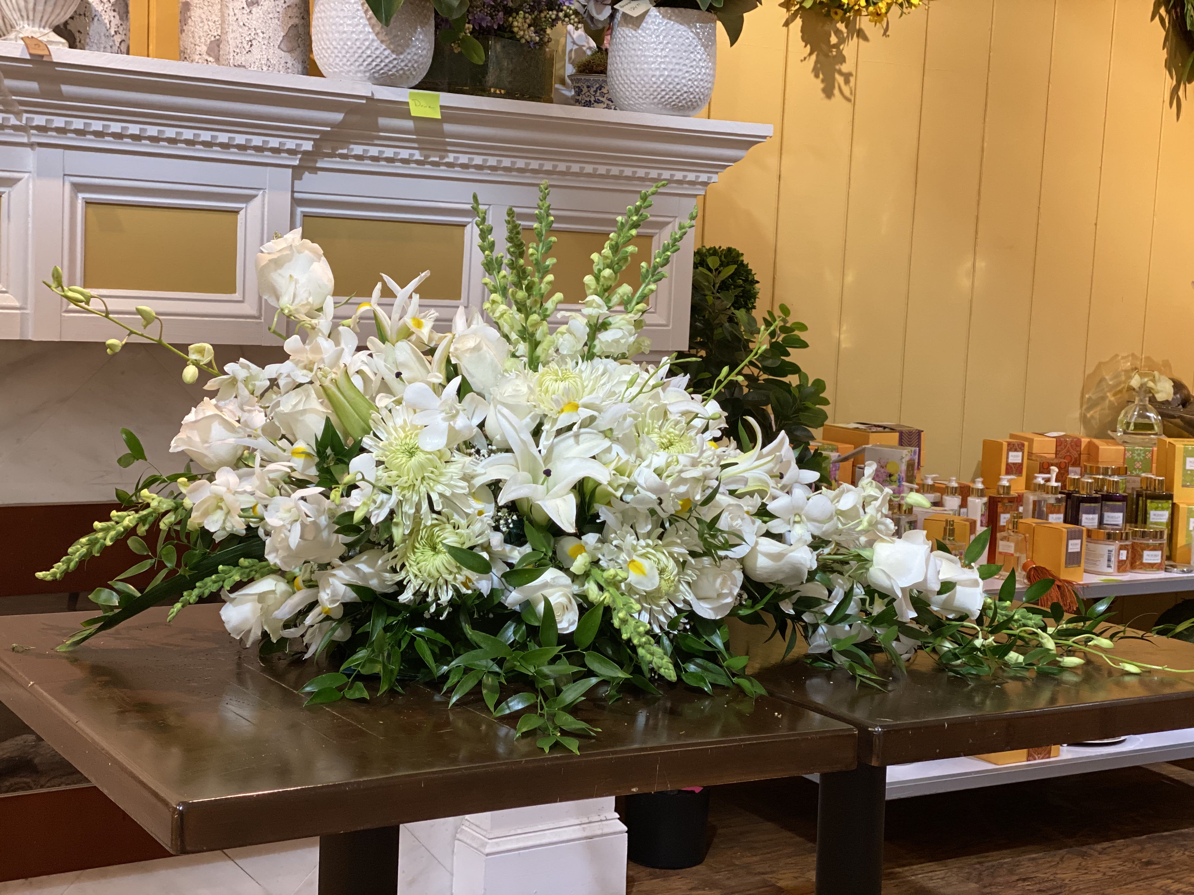 Large white floral arrangement on a table