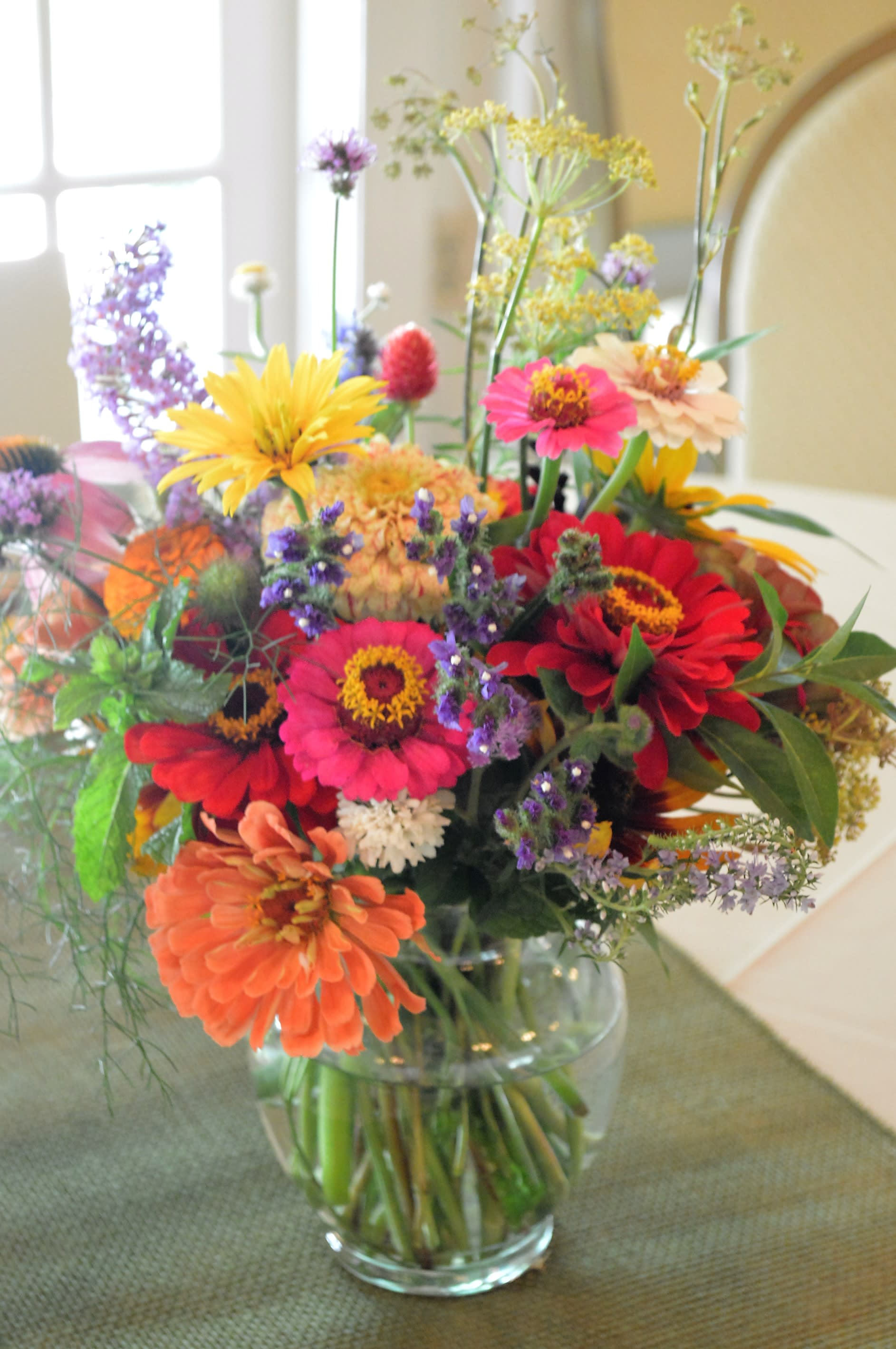 Colorful mixed bouquet in a clear glass vase