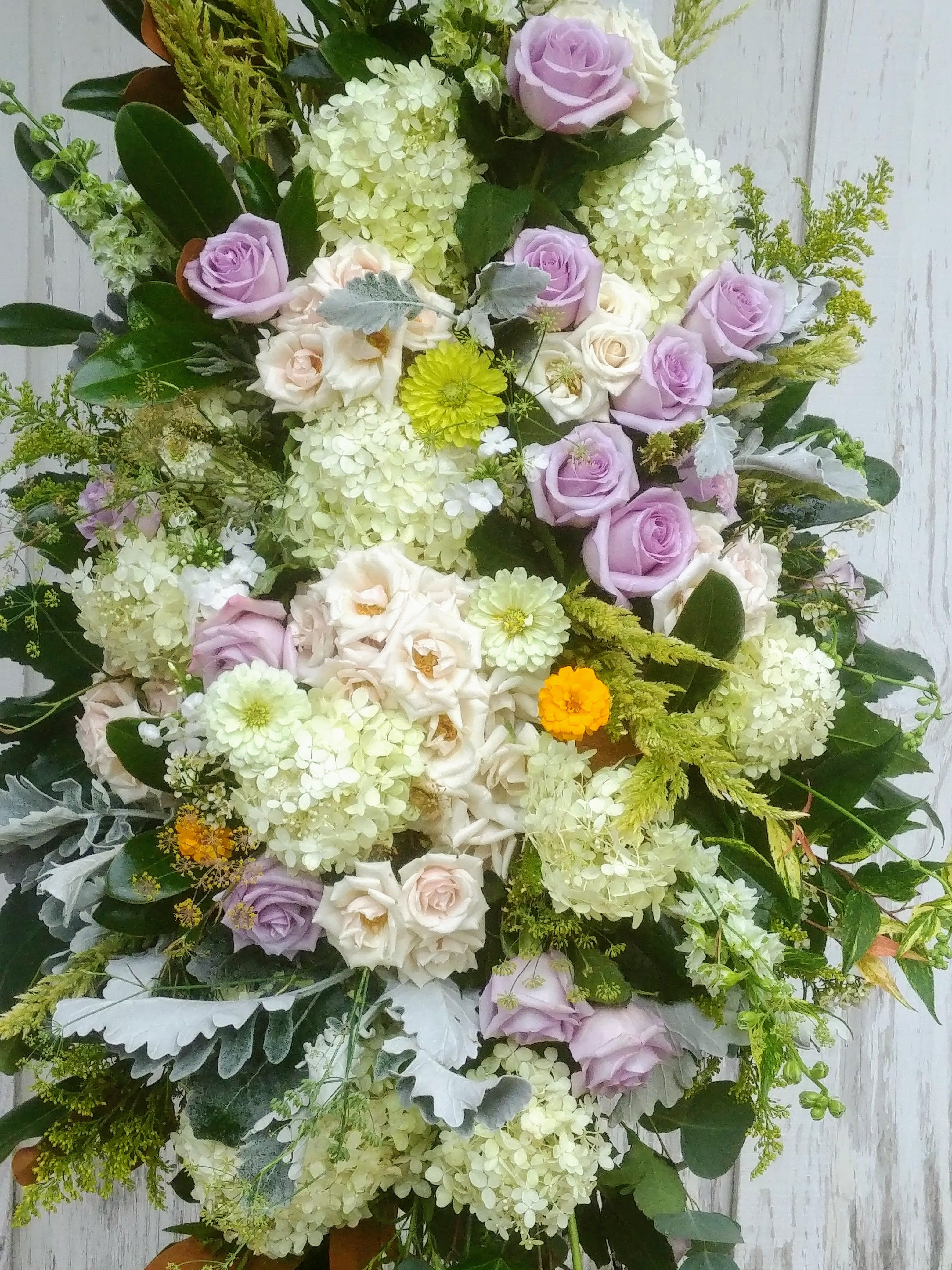 Large bouquet of lavender and white roses with pale hydrangeas