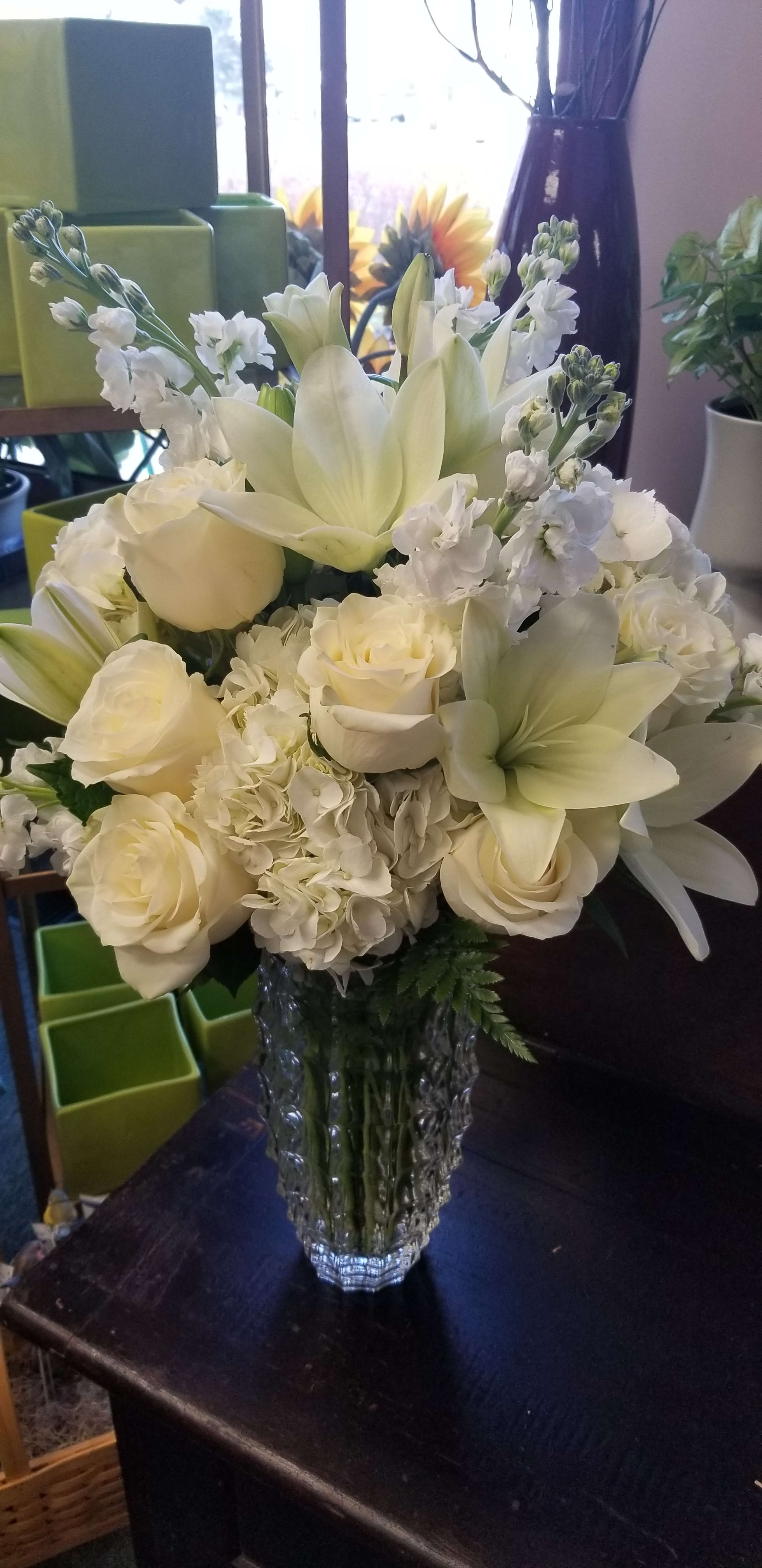 Hope Luxury Bouquet  - This arrangement is designed in a heavy luxury faceted vase.  It will include roses, stock, lillies, and hydrangeas.