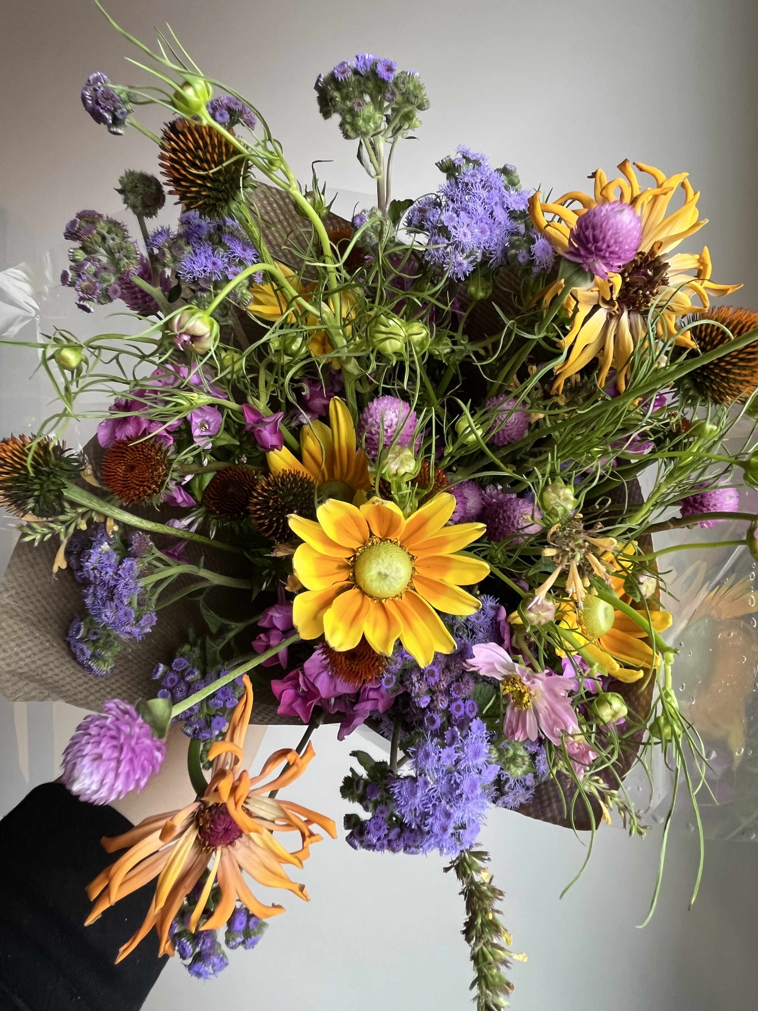 Mixed bouquet with yellow daisies and purple flowers