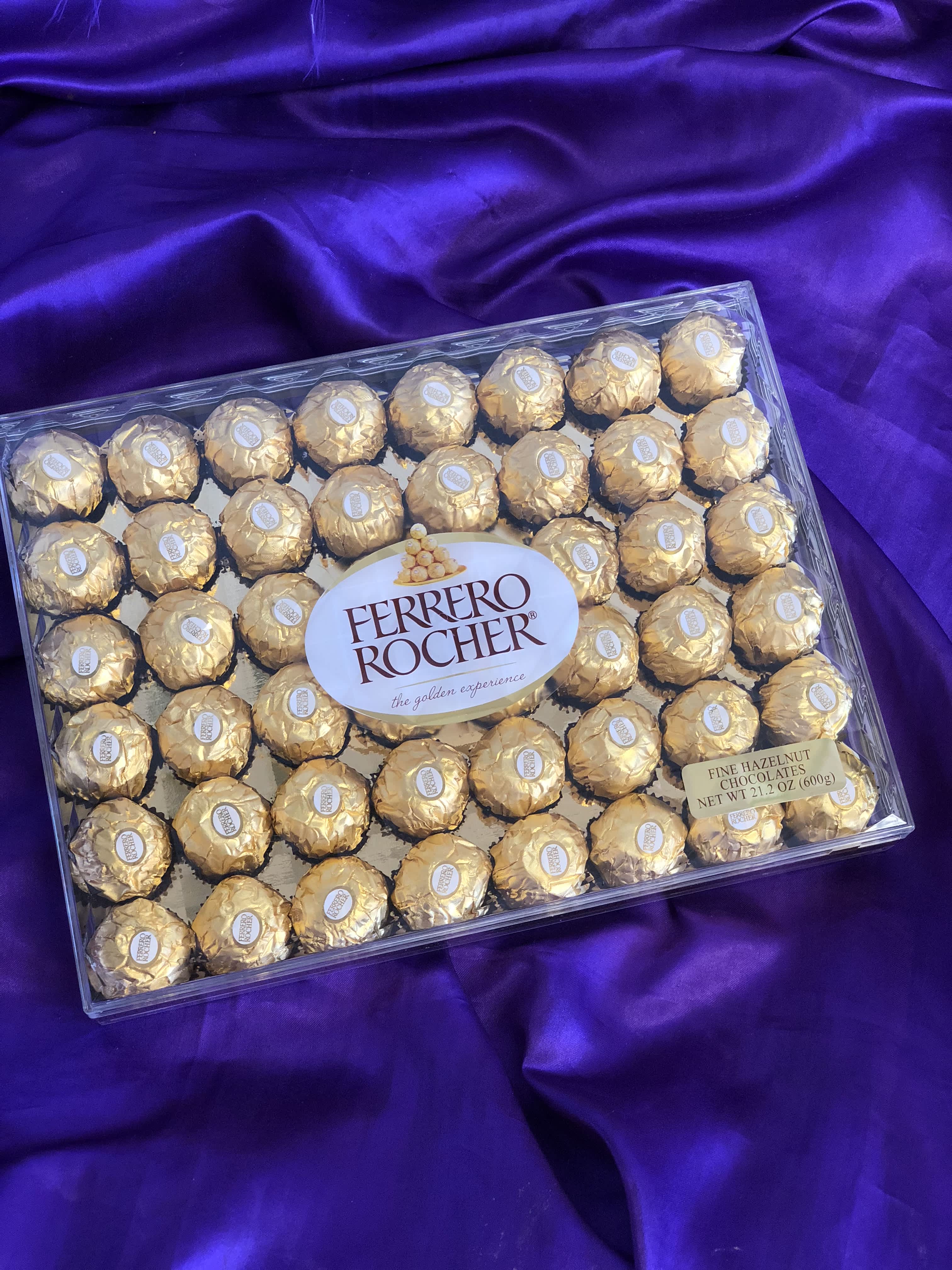 Box of Ferrero Rocher chocolates on purple fabric