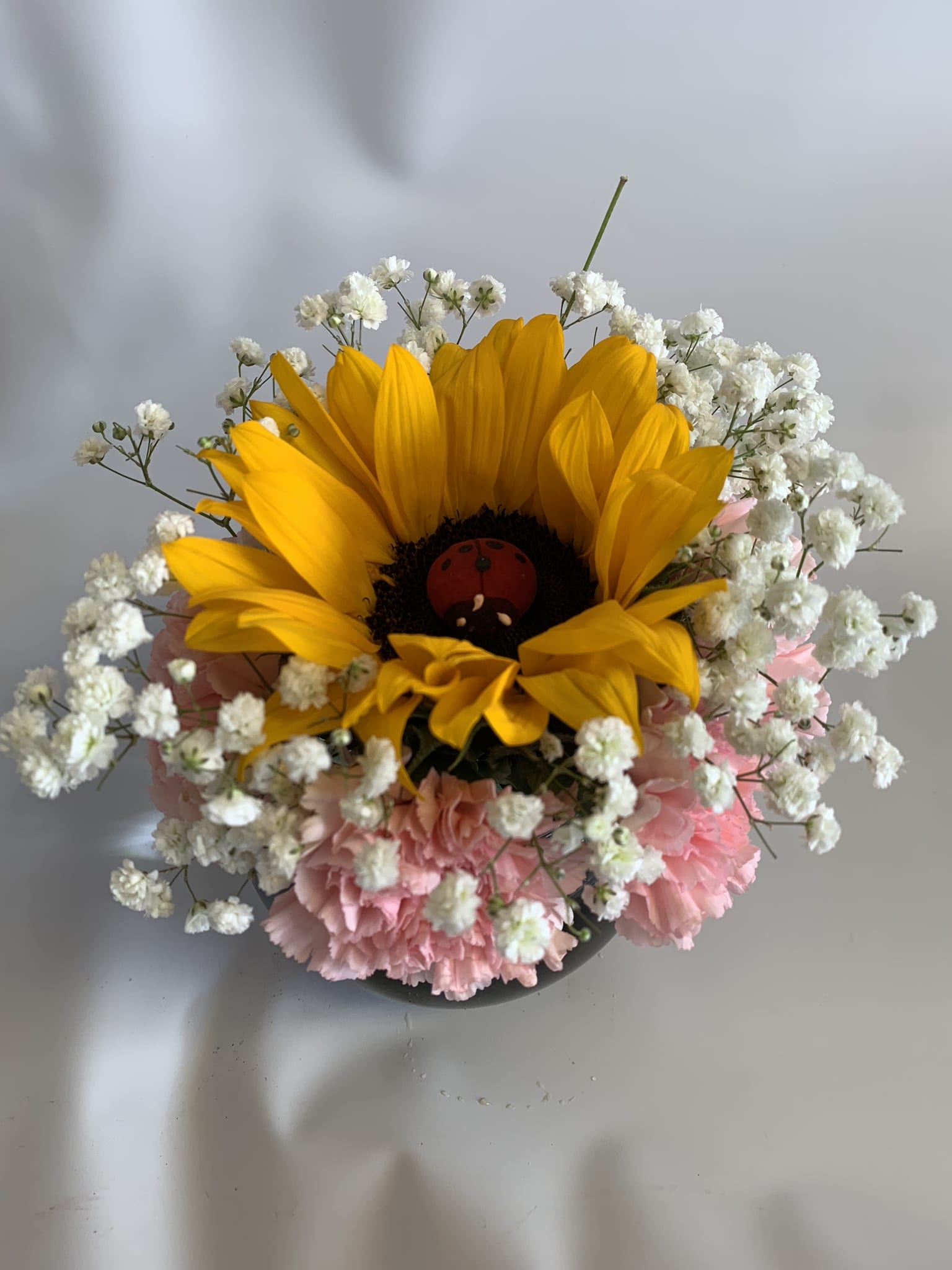 Sunflower bouquet with pink carnations and white baby's breath