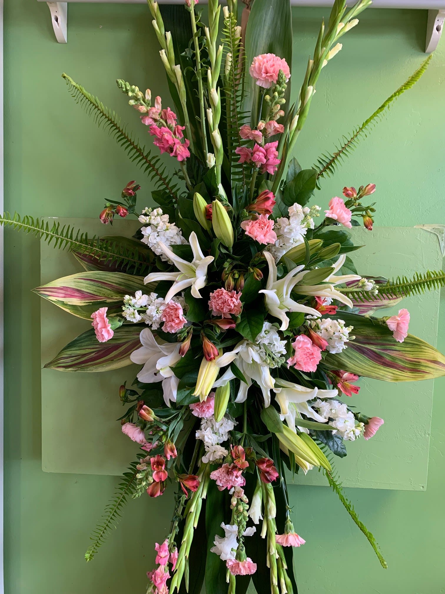 Tall floral spray with white lilies and pink carnations