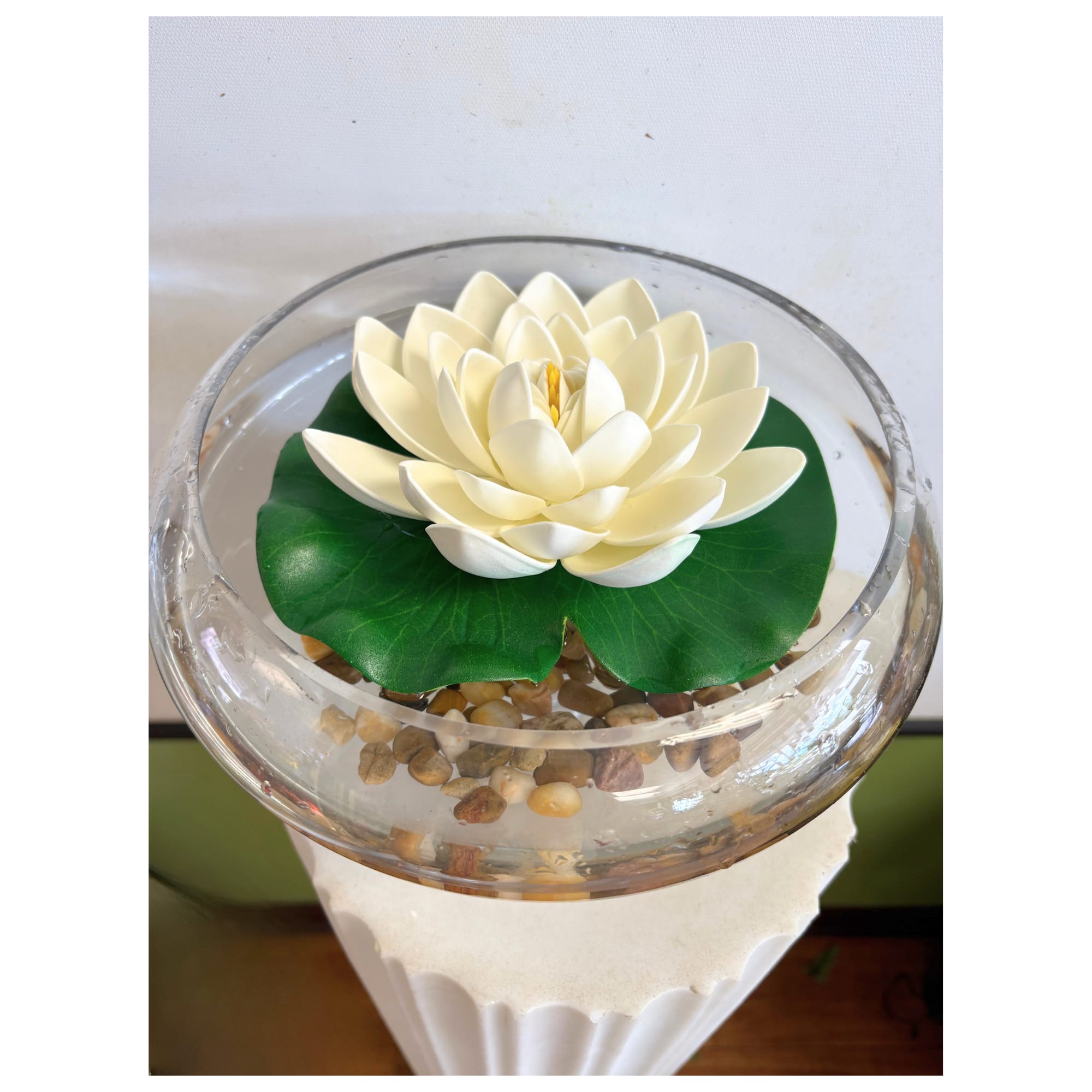 Silk Lotus - floating silk lotus over a bed of polished natural river stones