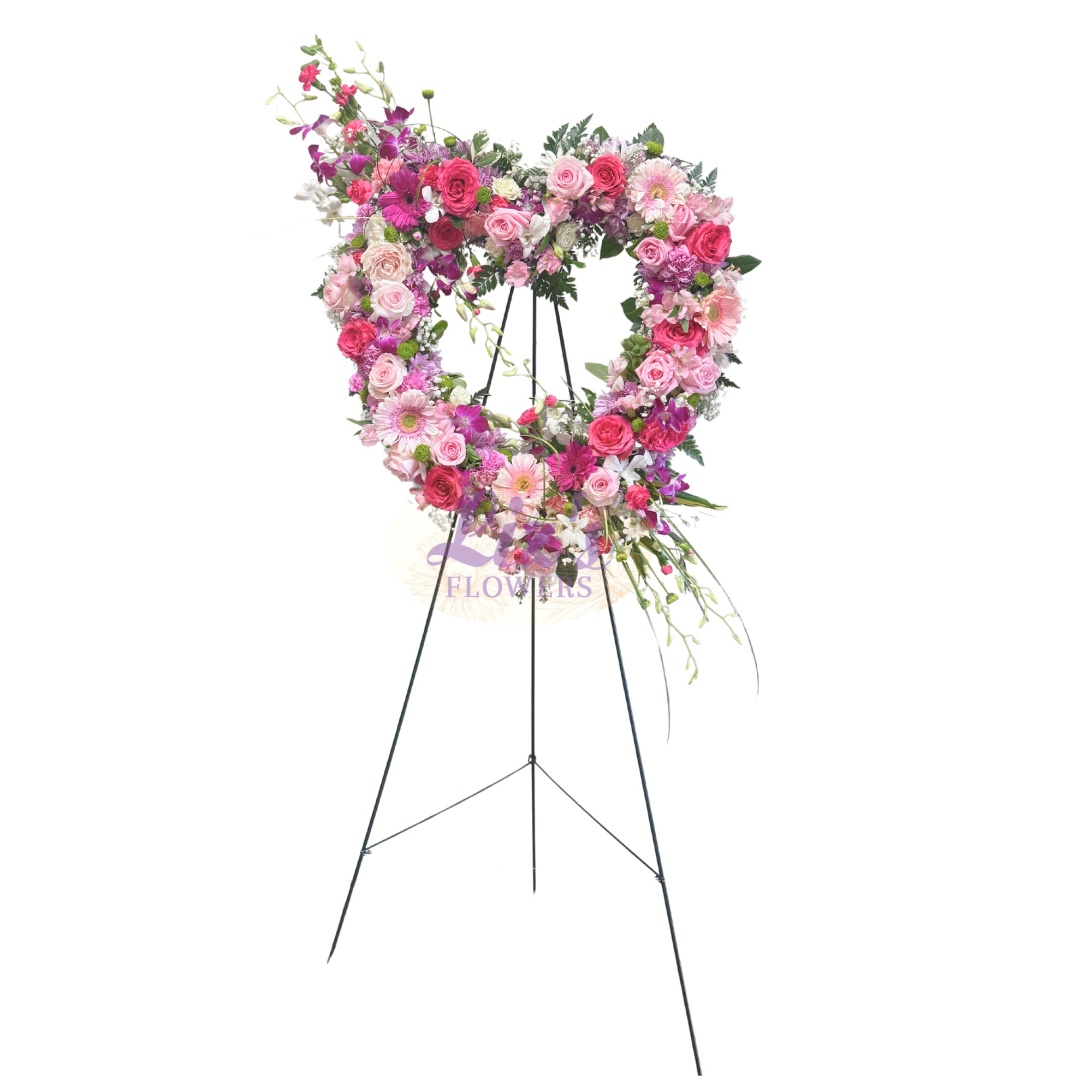 Eternal Devotion Heart Spray - Open heart spray, featuring a pink, hot pink, and lavender roses, carnations, gerberas, and purple orchid accents