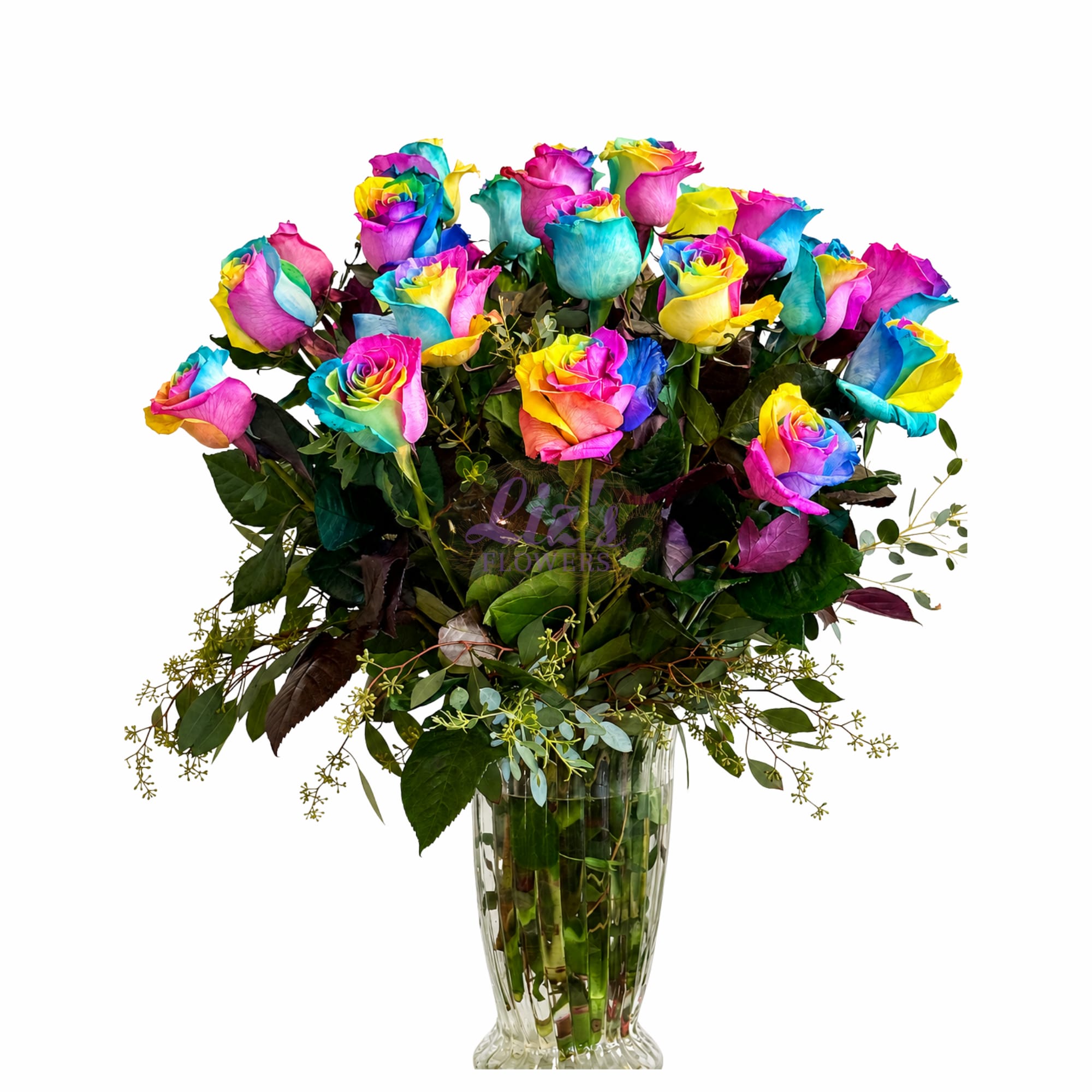 Two Dozen Rainbow Roses - Bring a kaleidoscope of color to any occasion with our stunning Rainbow Rose Arrangement. Featuring vibrant, multi-colored roses in vivid shades of pink, yellow, blue, and green, this bouquet is expertly arranged in a classic textured glass vase with lush foliage and delicate seeded greenery. Perfect for birthdays, celebrations, or to send a bright smile just because!