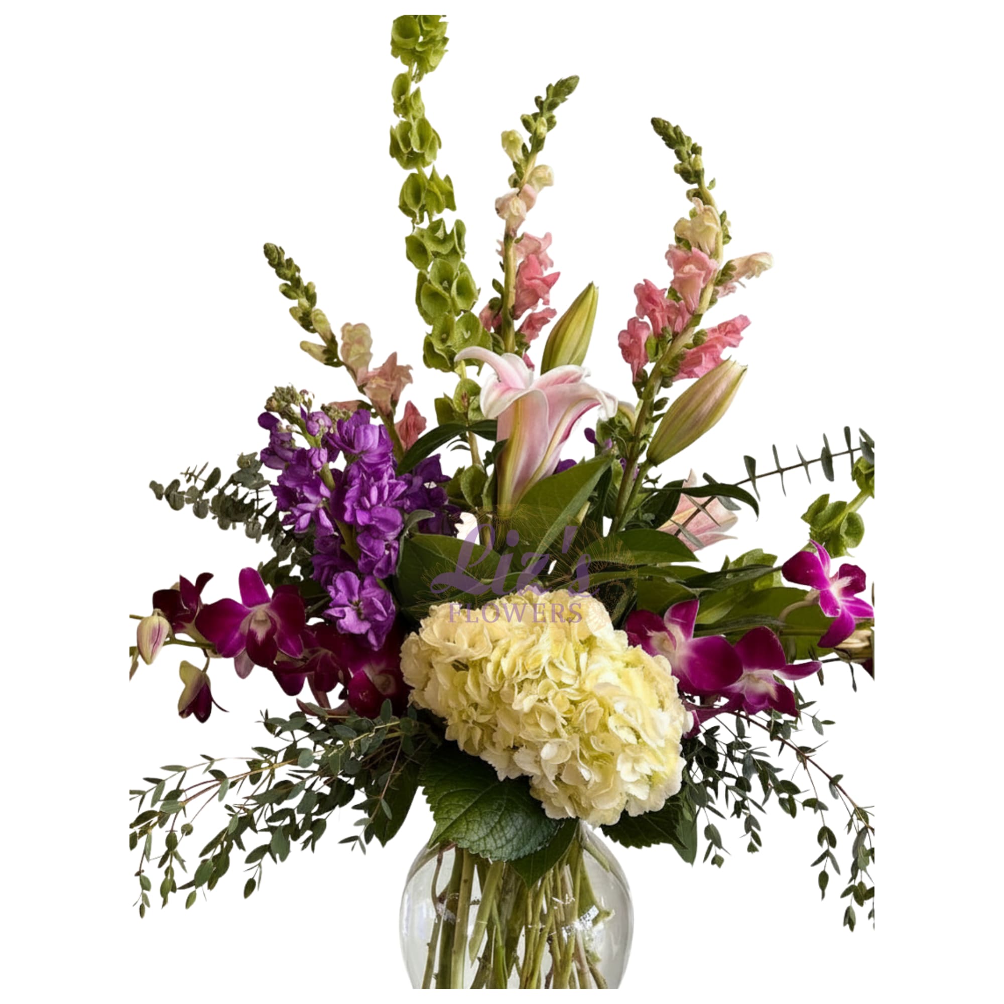 Artisan bouquet - Premium flowers arranged in a clear glass vase