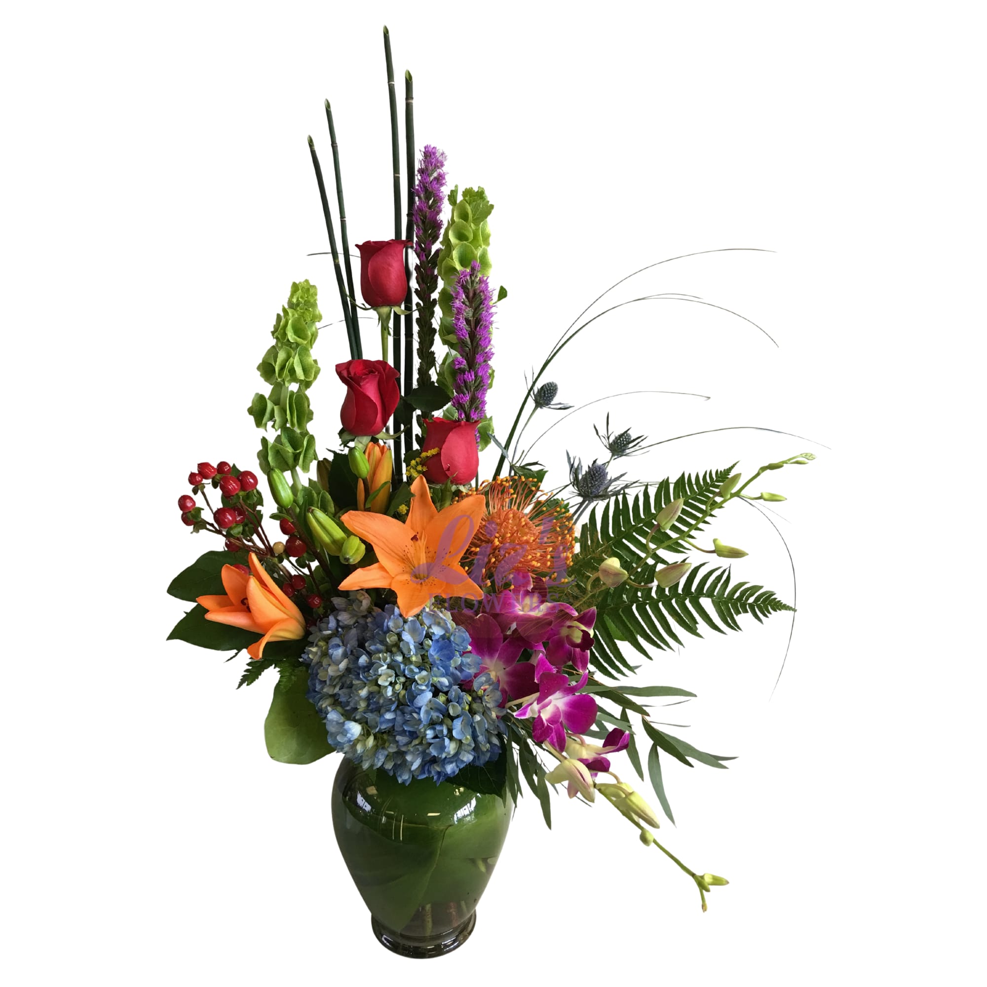 Tall mixed bouquet in a green glass vase with roses, lilies, orchids, and hydrangea