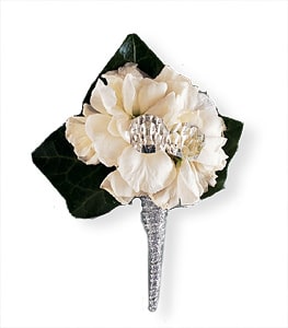 Cream flower boutonniere with dark green leaves and a silver stem wrap
