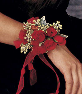 Red rose wrist corsage with a ribbon tie