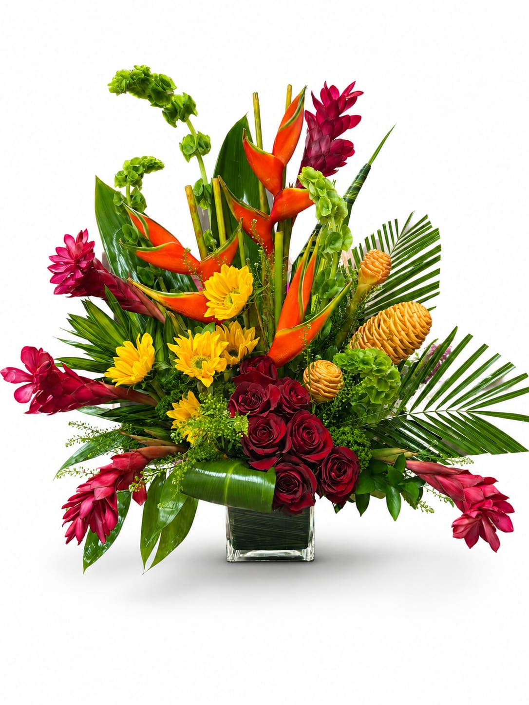 Tropical Sunset Splendor  - A bold and vibrant tropical arrangement featuring striking orange heliconia, rich burgundy roses, vibrant ginger blooms, golden sunflowers, and exotic tropical botanicals accented with lush palm foliage. Designed in a modern glass vase, this eye-catching arrangement brings warmth, elegance, and a touch of the tropics to any celebration, corporate setting, or special occasion.