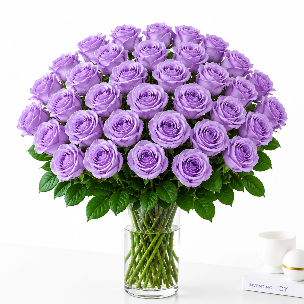 Bouquet of lavender roses in a clear glass vase