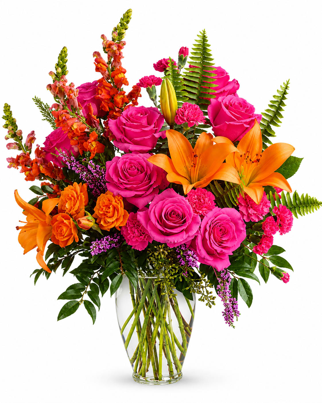 Bright mixed bouquet of pink roses, orange lilies, and orange snapdragons in a glass vase
