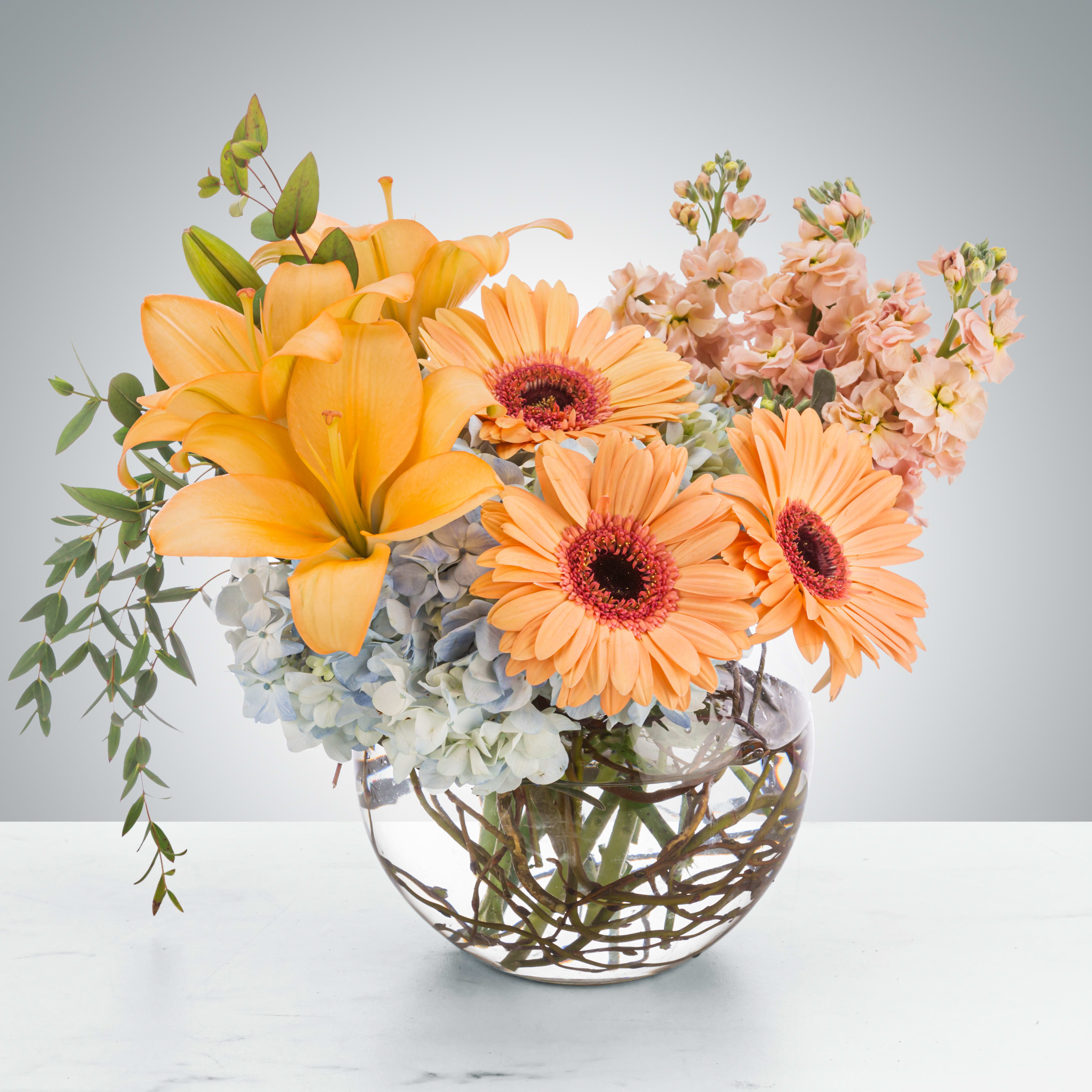 Tea Party by BloomNation™ - A chic and stylish bubble vase arrangement, this makes an elegant gift for anybody. Send it to in-laws, new clients, or new employees to leave a great impact. It also makes a great gift for Mother's Day.  Approximate Dimensions: 15"D x 13"H