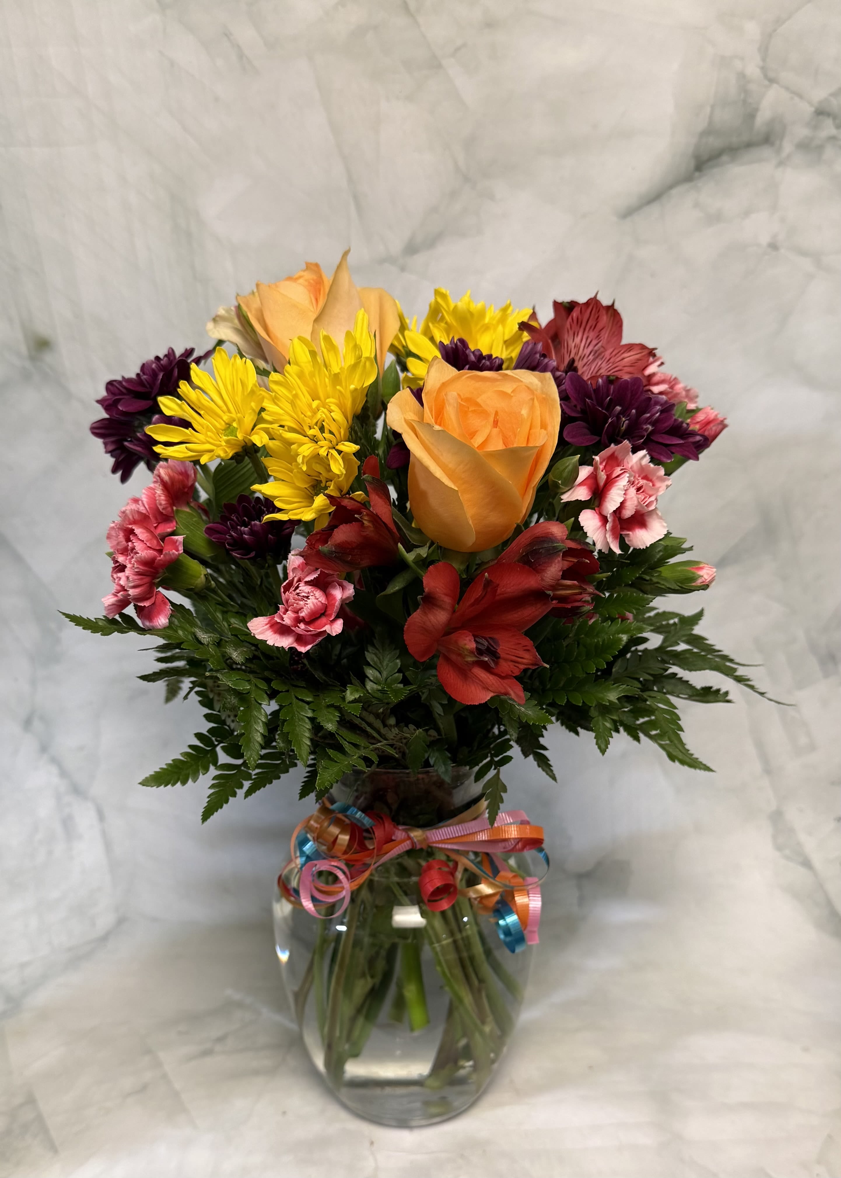 Party Time - Party on with this fun bouquet. An arrangement that is full of exciting flowers that last for days and days...and days. So when the party is over, they still have these beautiful flowers to enjoy.