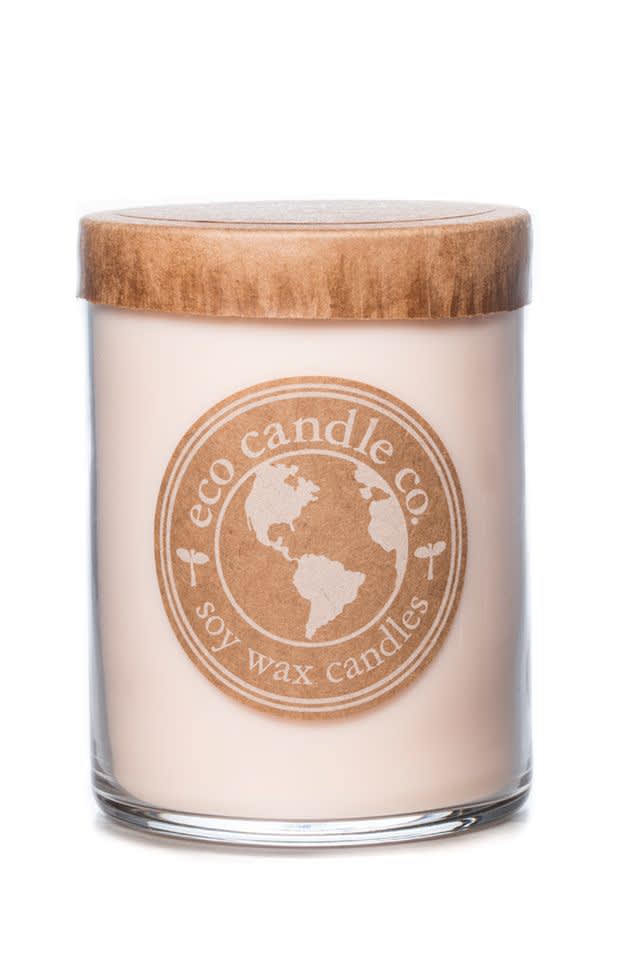 Soy wax candle in a glass jar with a wooden lid