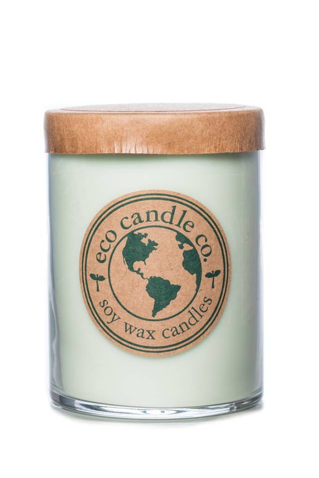 Soy wax candle in a glass jar with a wooden lid