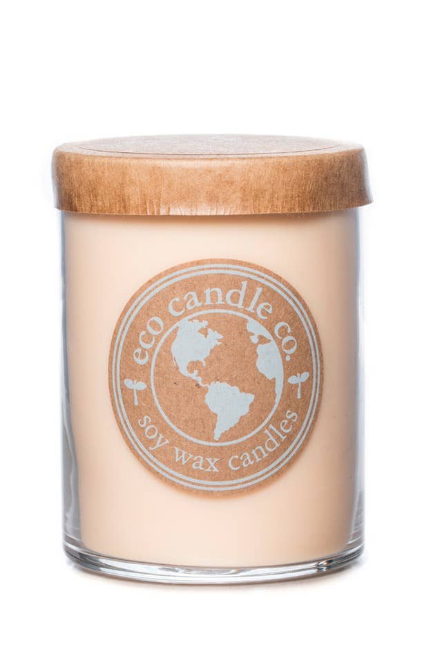 Soy wax candle in a clear glass jar with a wooden lid