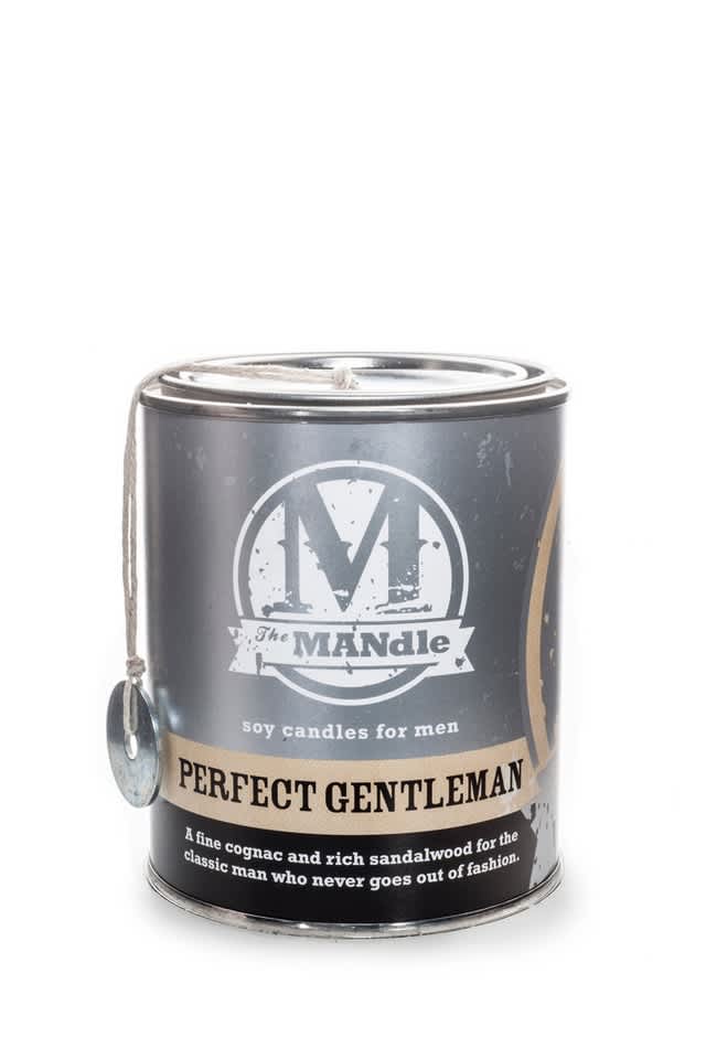 A black tin candle labeled "Perfect Gentleman" with a hanging tag