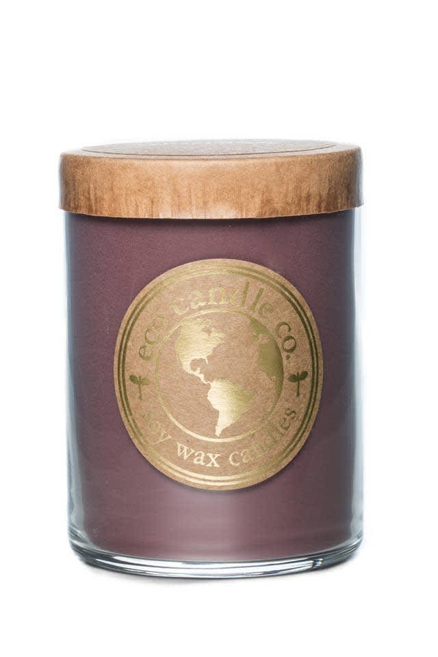 Purple candle in a glass jar with a wooden lid