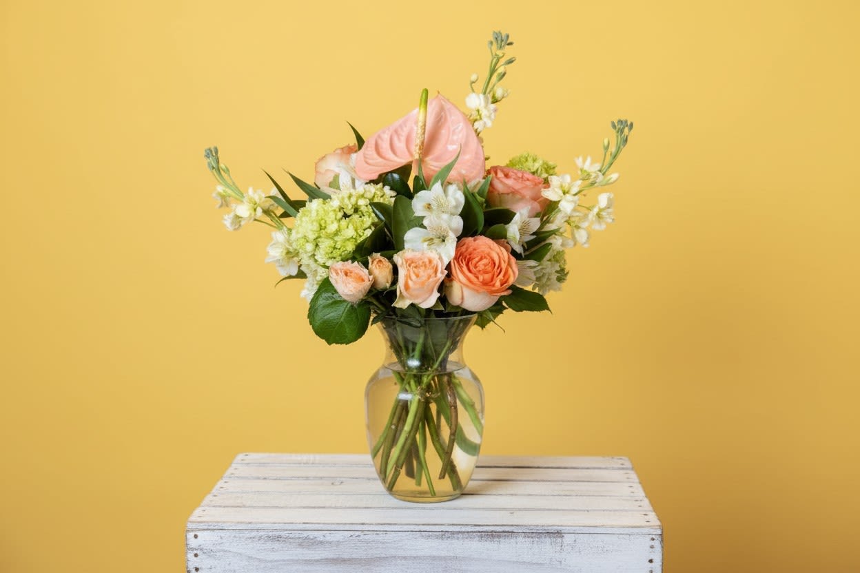 Peaches &amp; Greens - Soft peach roses and blooms give this flower arrangement a warm, uplifting focal point that feels both contemporary and inviting - ideal as a birthday bouquet, Mother's Day surprise, or a cheerful "just because" pick-me-up. The flower arrangement pairs peach, green, white, and yellow tones for an easygoing spring or summer look that also reads perfectly for Easter, thank-you gestures, graduations, and thinking-of-you moments.12 in W X 16 in tall