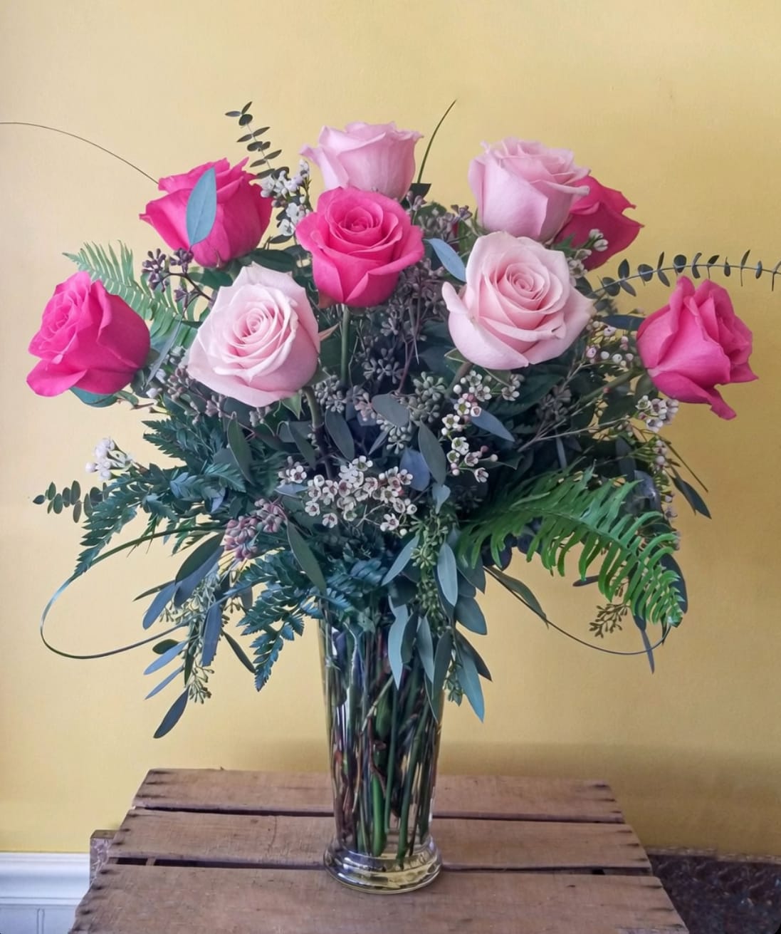5 Star Dozen Mixed Pink Roses - Want to impress someone with something a little more special than a traditional classic rose bouquet? Send this 5 Star Rose bouquet. The roses are designed with high end greens and premium accents in place of the traditional babies breath. It's surely to make a great impression! Roses will come in a variety of shades on pinks.  Approx dimensions 26in x22in for standard  Standard = 12 roses Deluxe = 18 roses Premium = 24 roses