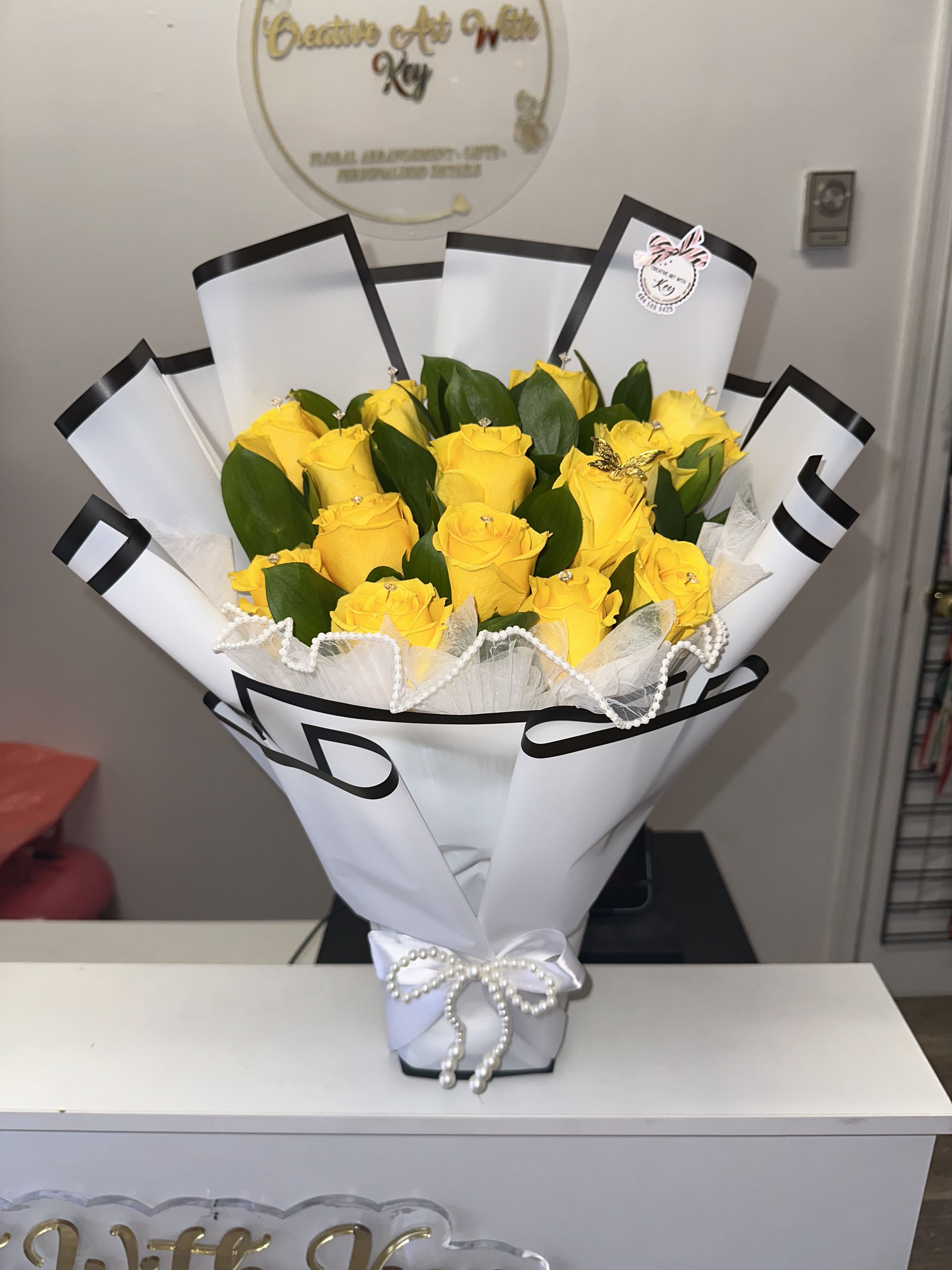 Yellow roses, each one bearing its own diamond, metal butterfly, pearl ribbon, white paper - Yellow roses, each one bearing its own diamond, metal butterfly, pearl ribbon, white paper
