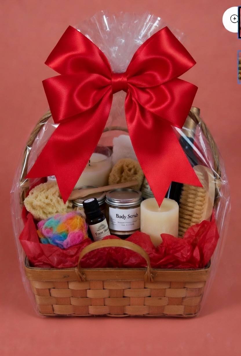 Gift basket with bath items, candles, and a large red bow